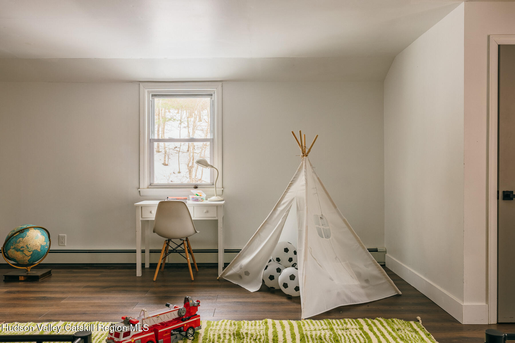 354 Slate Quarry Road Rhinebeck, NY 12572 - Photo 26 of 33 a living room with furniture and a wooden floor