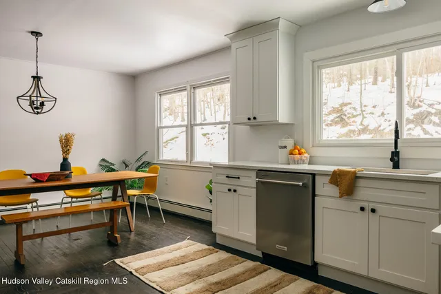 a kitchen with a sink and a window