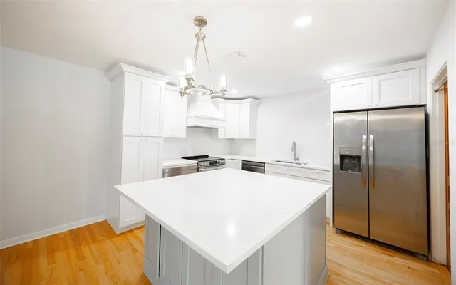 a kitchen with a stove and a microwave