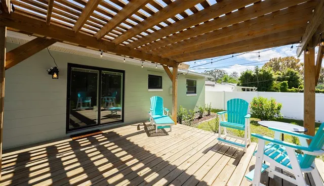 a front view of a house with swimming pool garden and patio