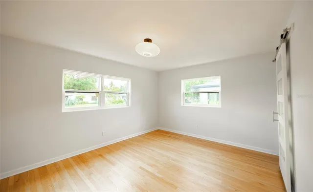 a bedroom with a bed and bathroom