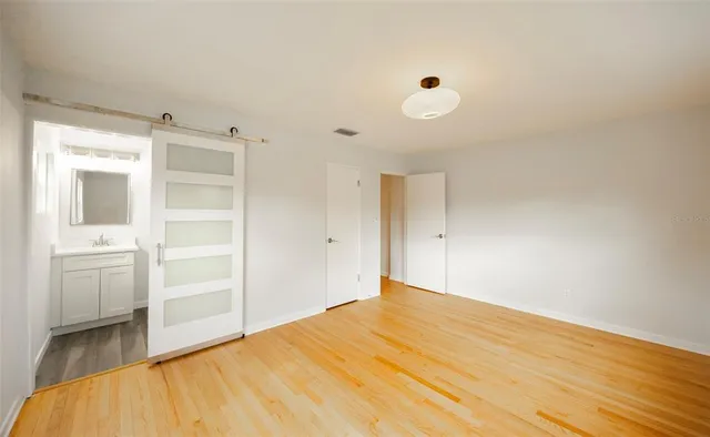 a bathroom with a double vanity sink mirror and shower