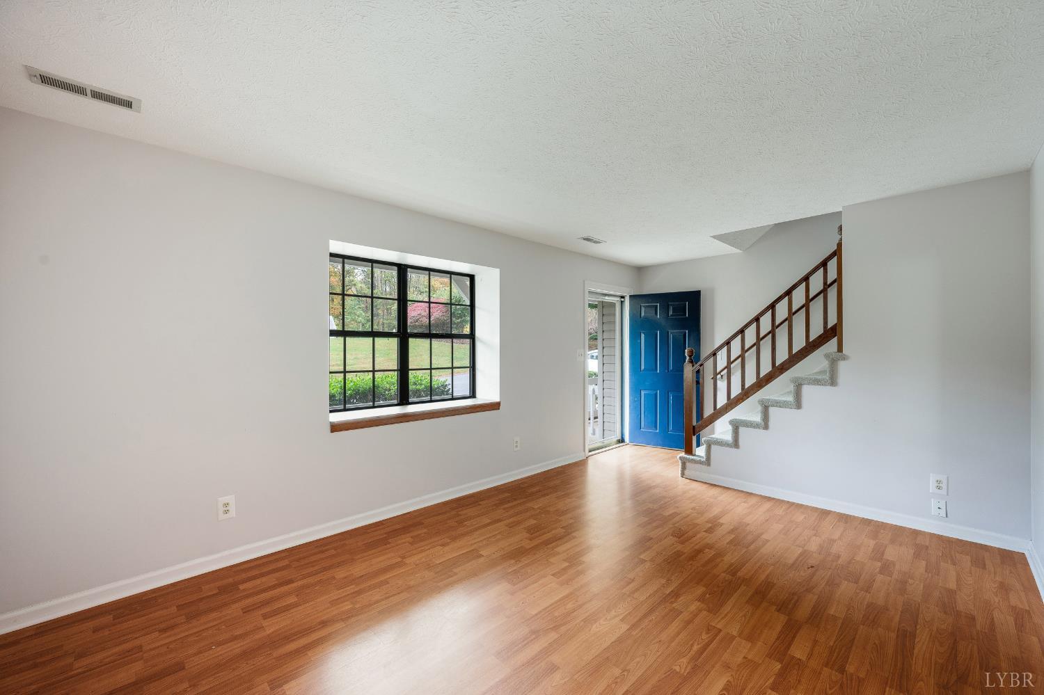 102 Goose Ridge Drive Forest, VA 24551 - Photo 12 of 57 a view of an empty room with wooden floor and a window