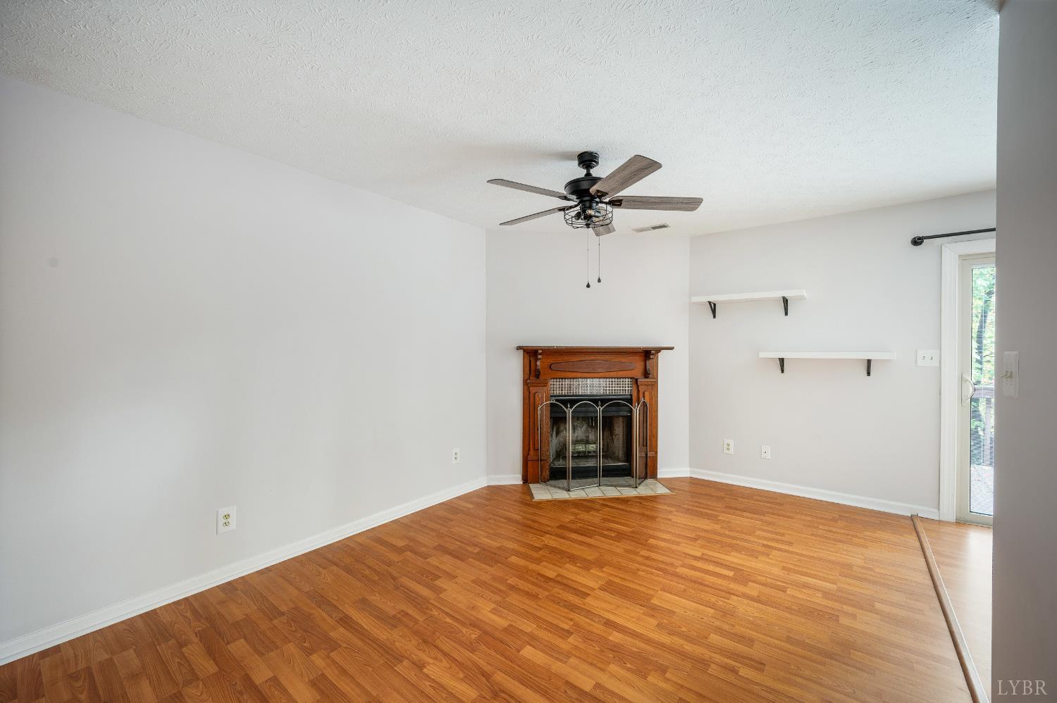 102 Goose Ridge Drive Forest, VA 24551 - Photo 15 of 57 a view of an empty room with a fireplace and a window