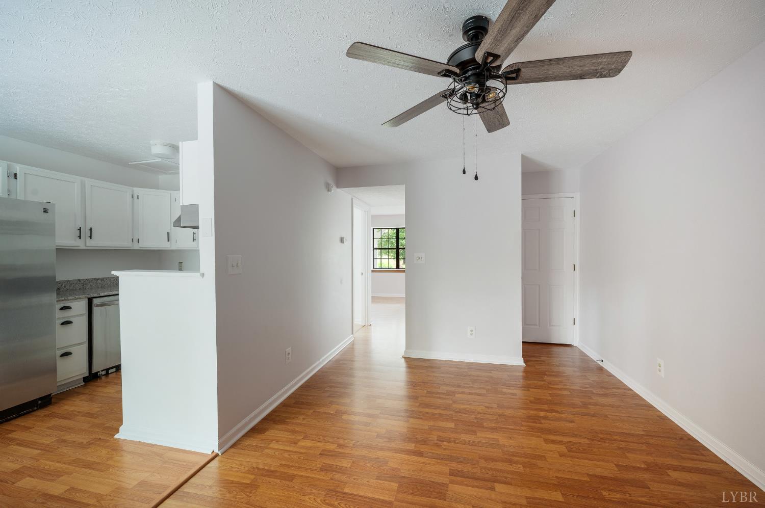 102 Goose Ridge Drive Forest, VA 24551 - Photo 19 of 57 a view of an empty room with a kitchen