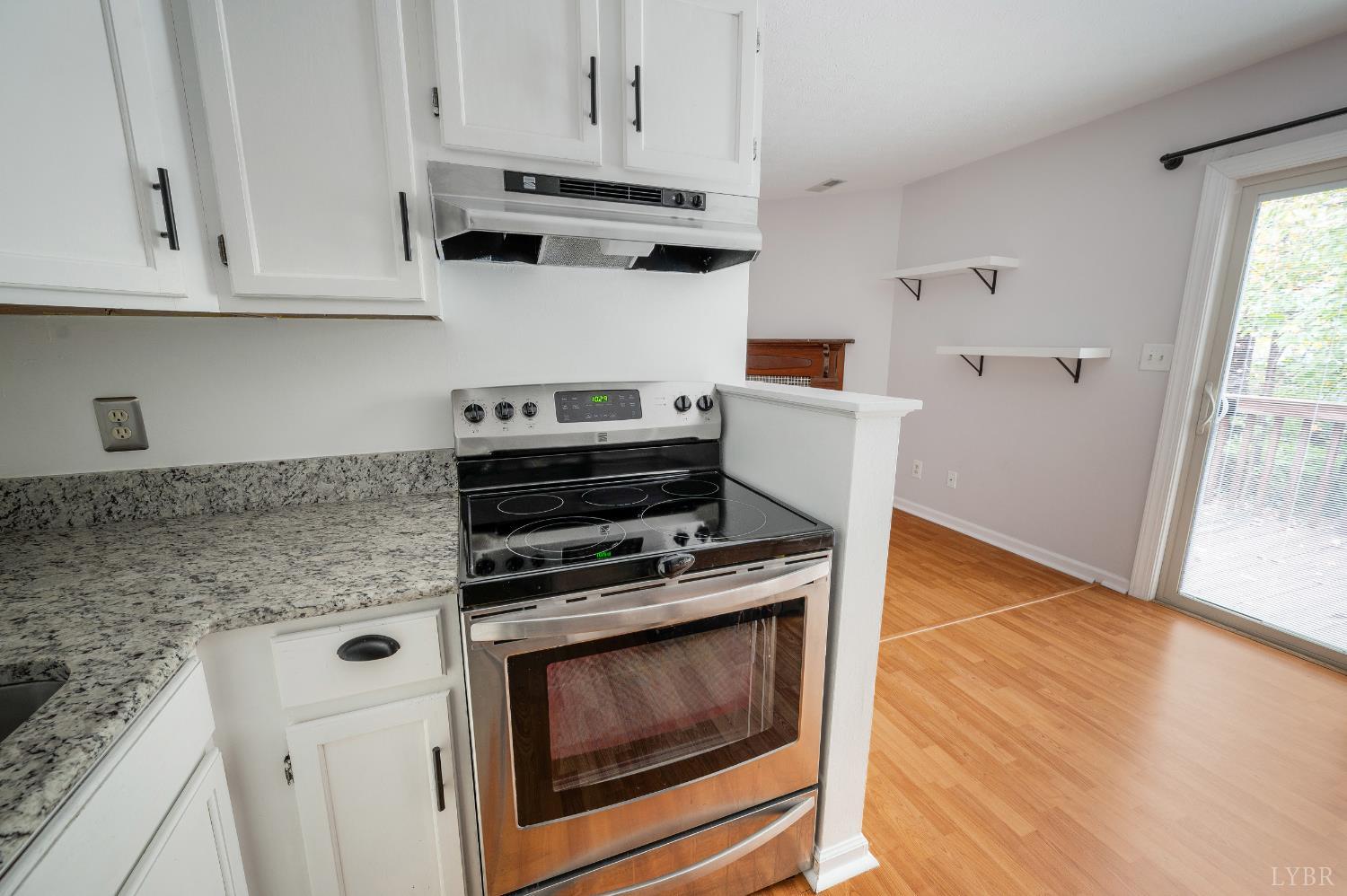 102 Goose Ridge Drive Forest, VA 24551 - Photo 23 of 57 a kitchen with granite countertop cabinets stainless steel appliances and wooden floor
