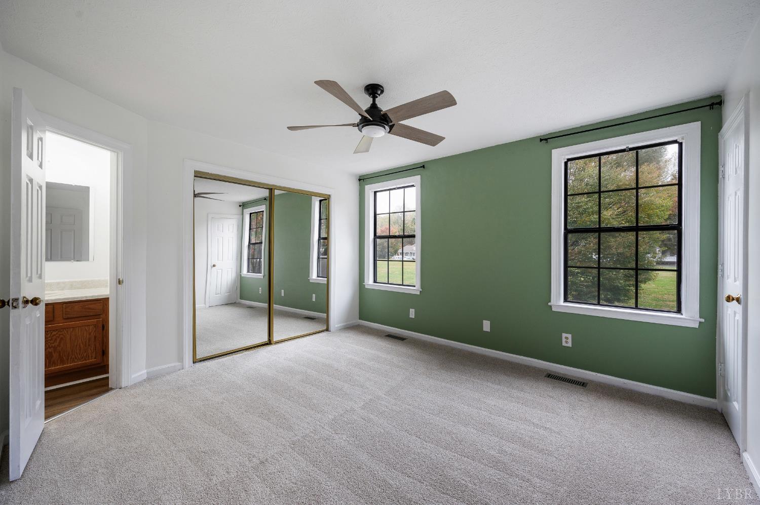 102 Goose Ridge Drive Forest, VA 24551 - Photo 26 of 57 a view of an empty room with a window and a kitchen