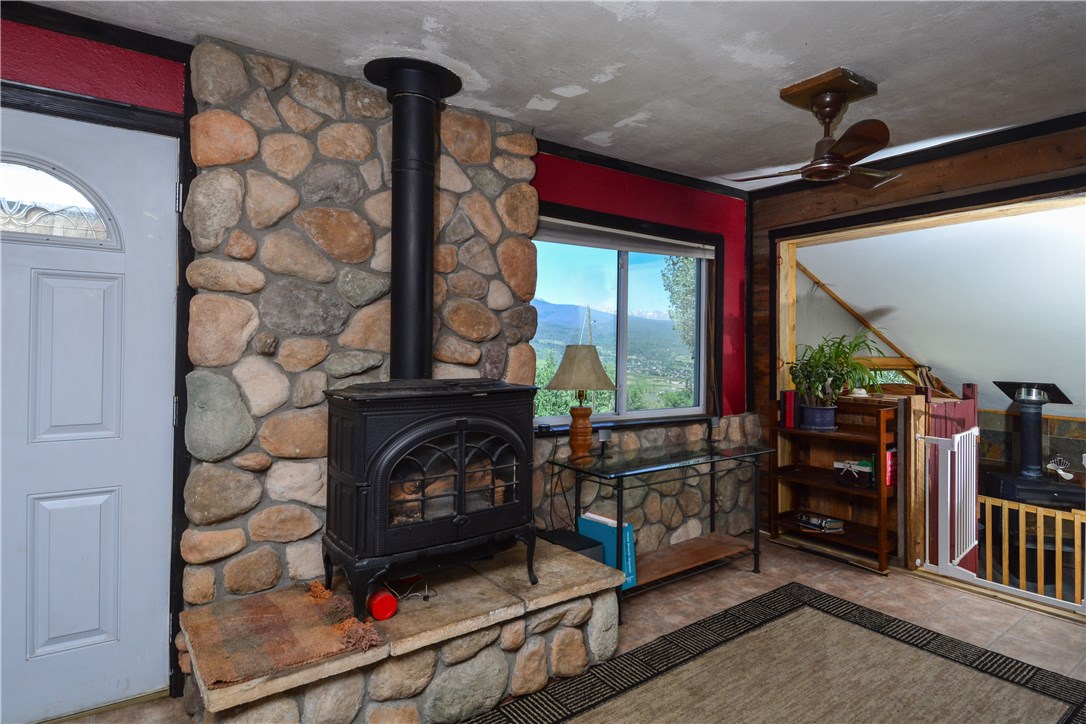 89 V Road Silverthorne, CO 80498 - Photo 6 of 25 Cozy gas stove regulated by a thermostat to keep the home warm when not in use.