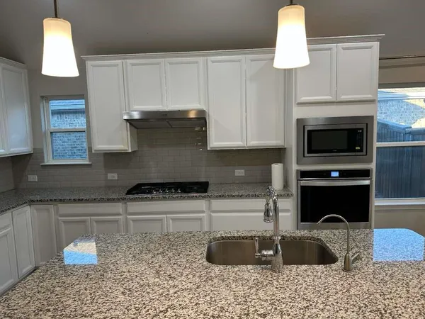 a view of kitchen and utility room