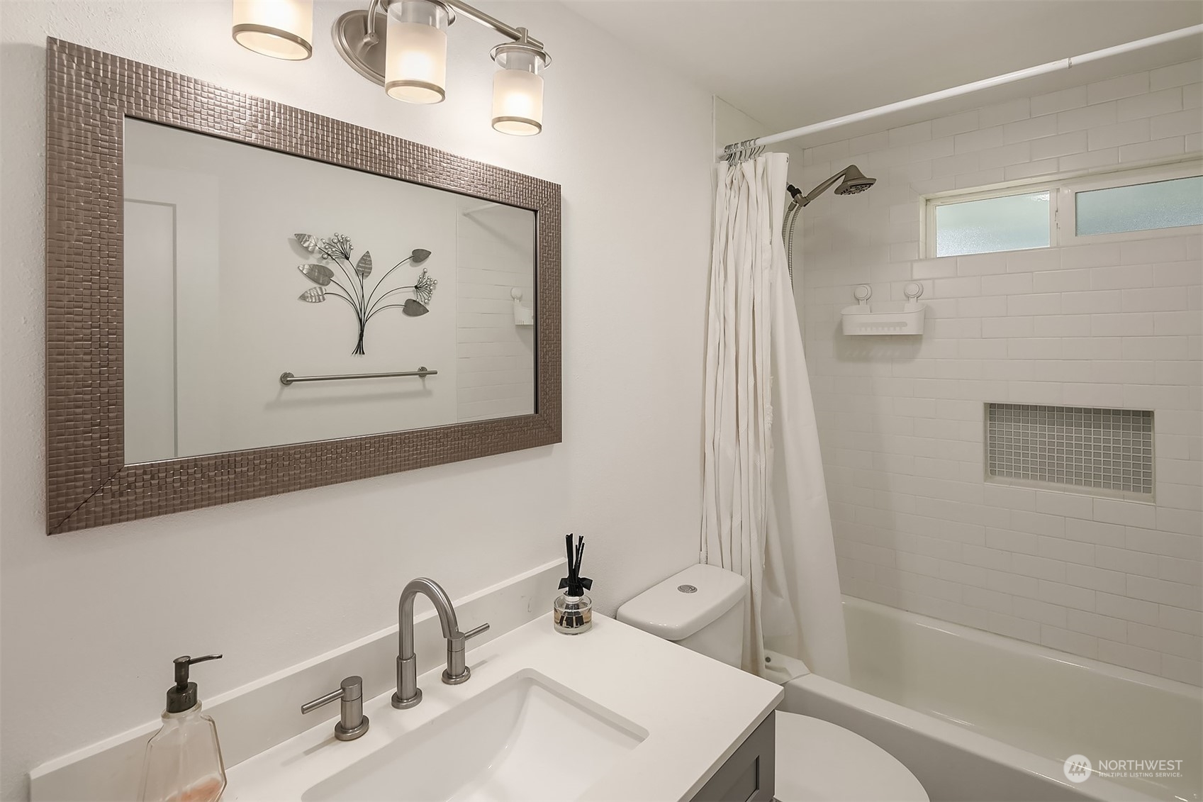 4419 Southeast 4th Place Renton, WA 98059 - Photo 5 of 21 a bathroom with a bathtub and a sink