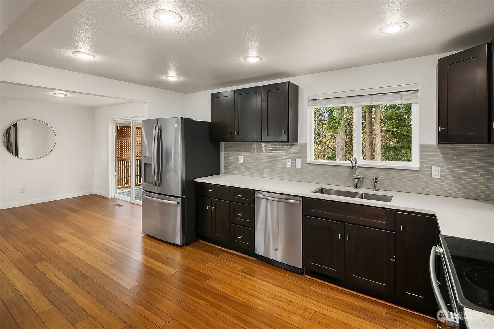 4419 Southeast 4th Place Renton, WA 98059 - Photo 9 of 21 a kitchen with stainless steel appliances granite countertop a sink stove and refrigerator