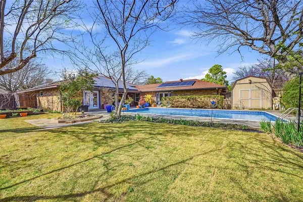 a view of swimming pool with outdoor seating