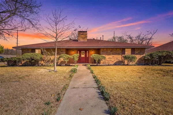 a view of a yard with cars