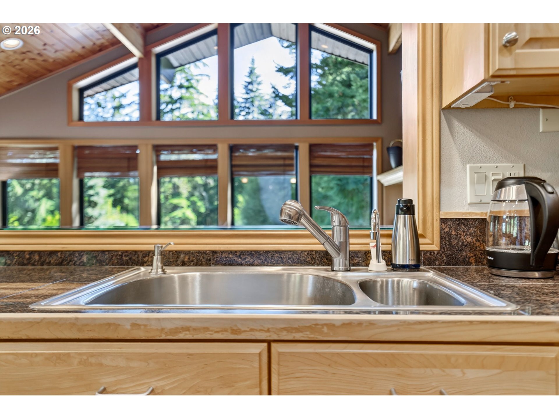 18685 East Aschoff Road Rhododendron, OR 97049 - Photo 11 of 48 a view of a sink and cabinet with a living room