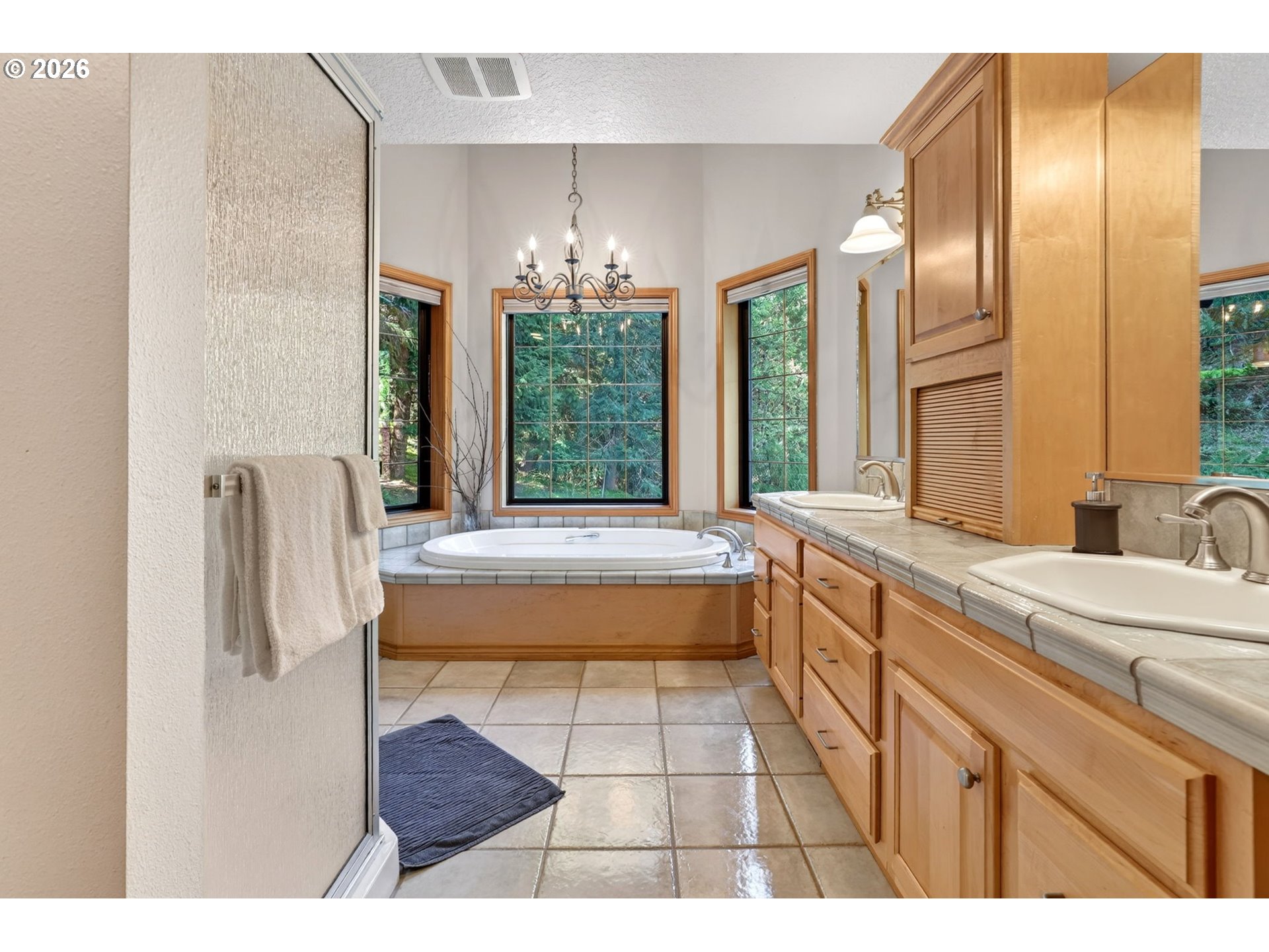 18685 East Aschoff Road Rhododendron, OR 97049 - Photo 16 of 48 a spacious bathroom with a granite countertop sink a mirror and a bathtub