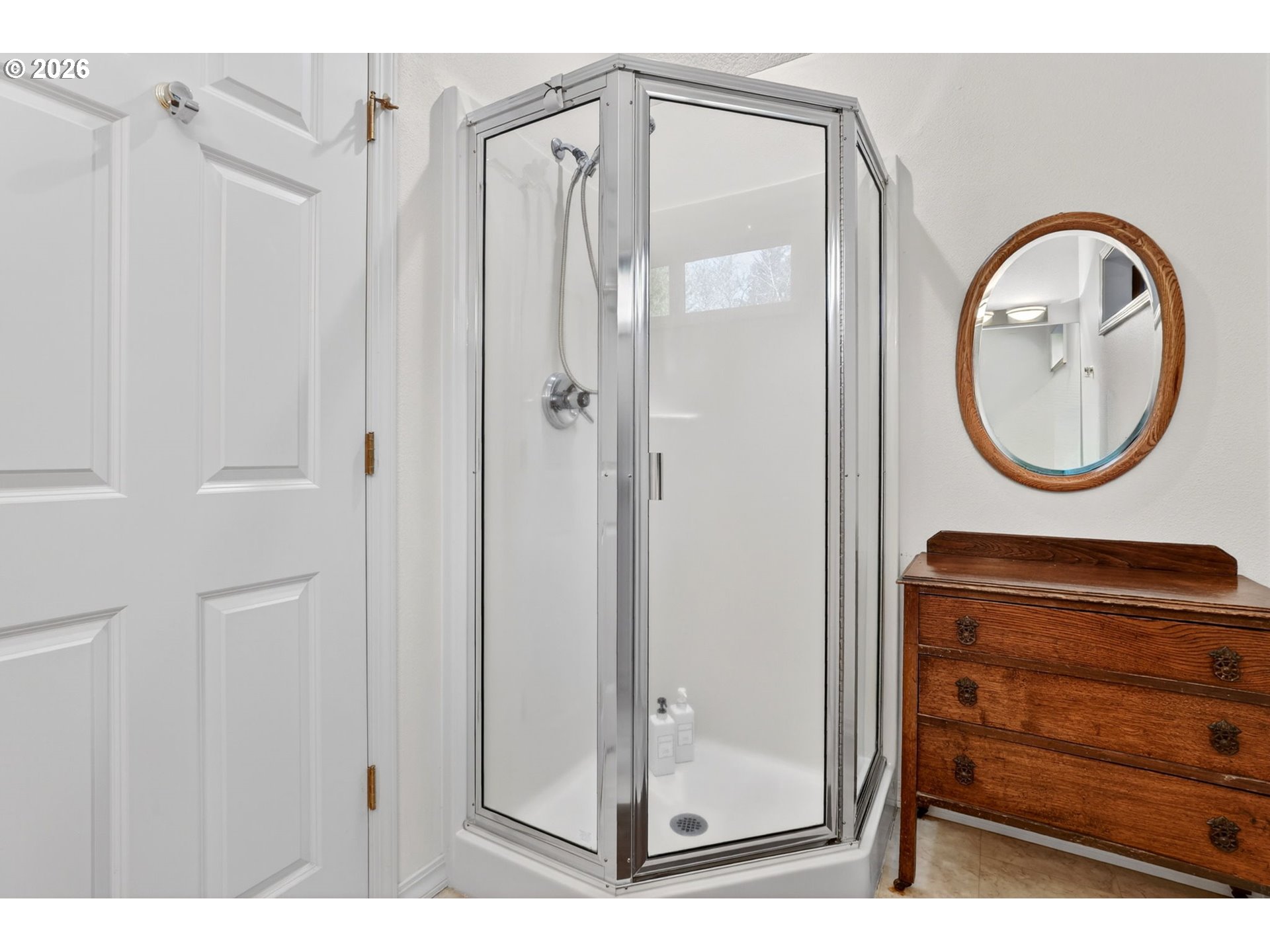 18685 East Aschoff Road Rhododendron, OR 97049 - Photo 21 of 48 a bathroom with a shower a mirror and a sink