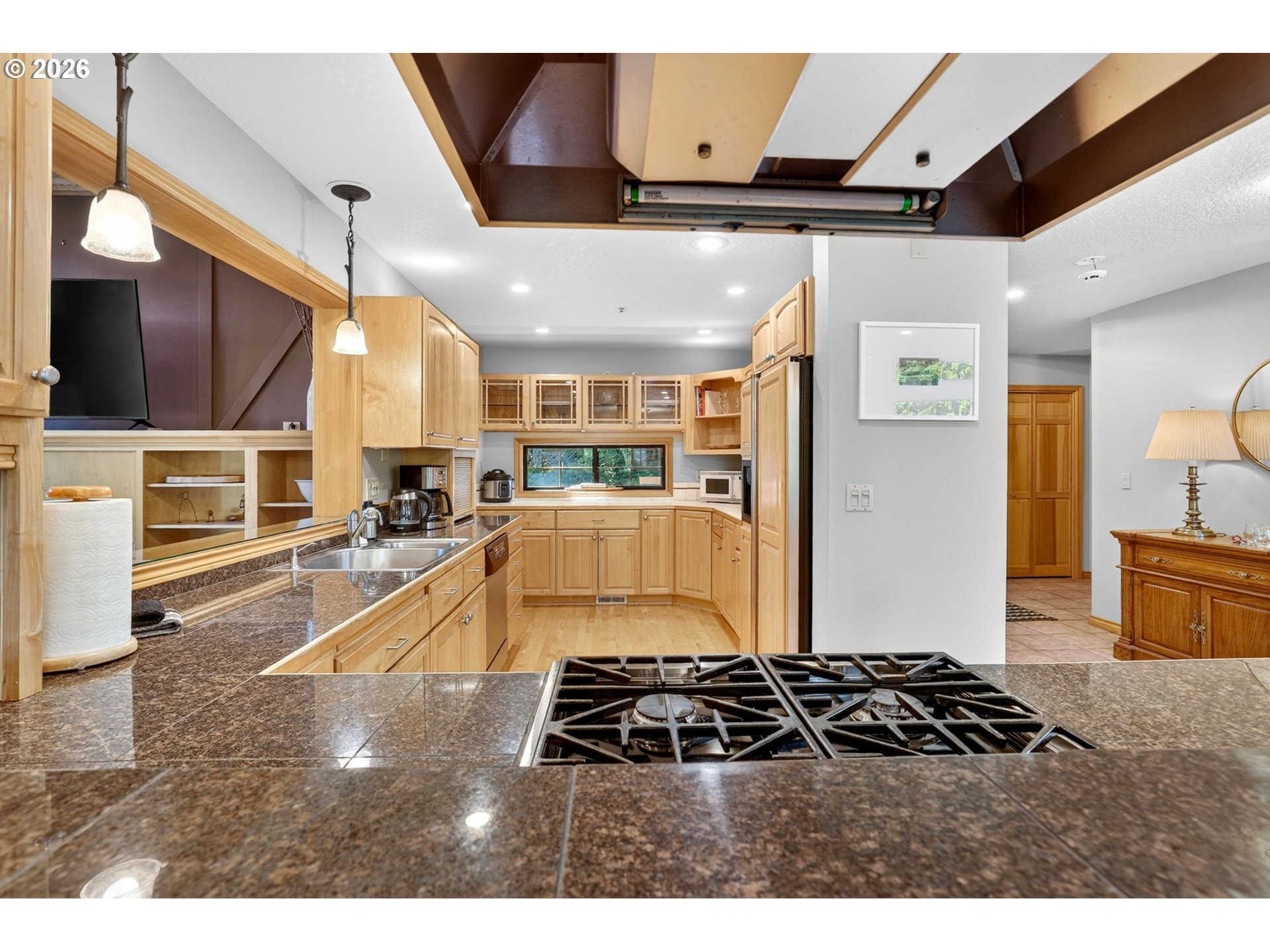 18685 East Aschoff Road Rhododendron, OR 97049 - Photo 10 of 48 a kitchen with stainless steel appliances granite countertop a stove and a refrigerator