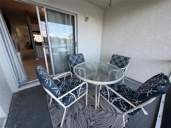 a table and chairs in a balcony