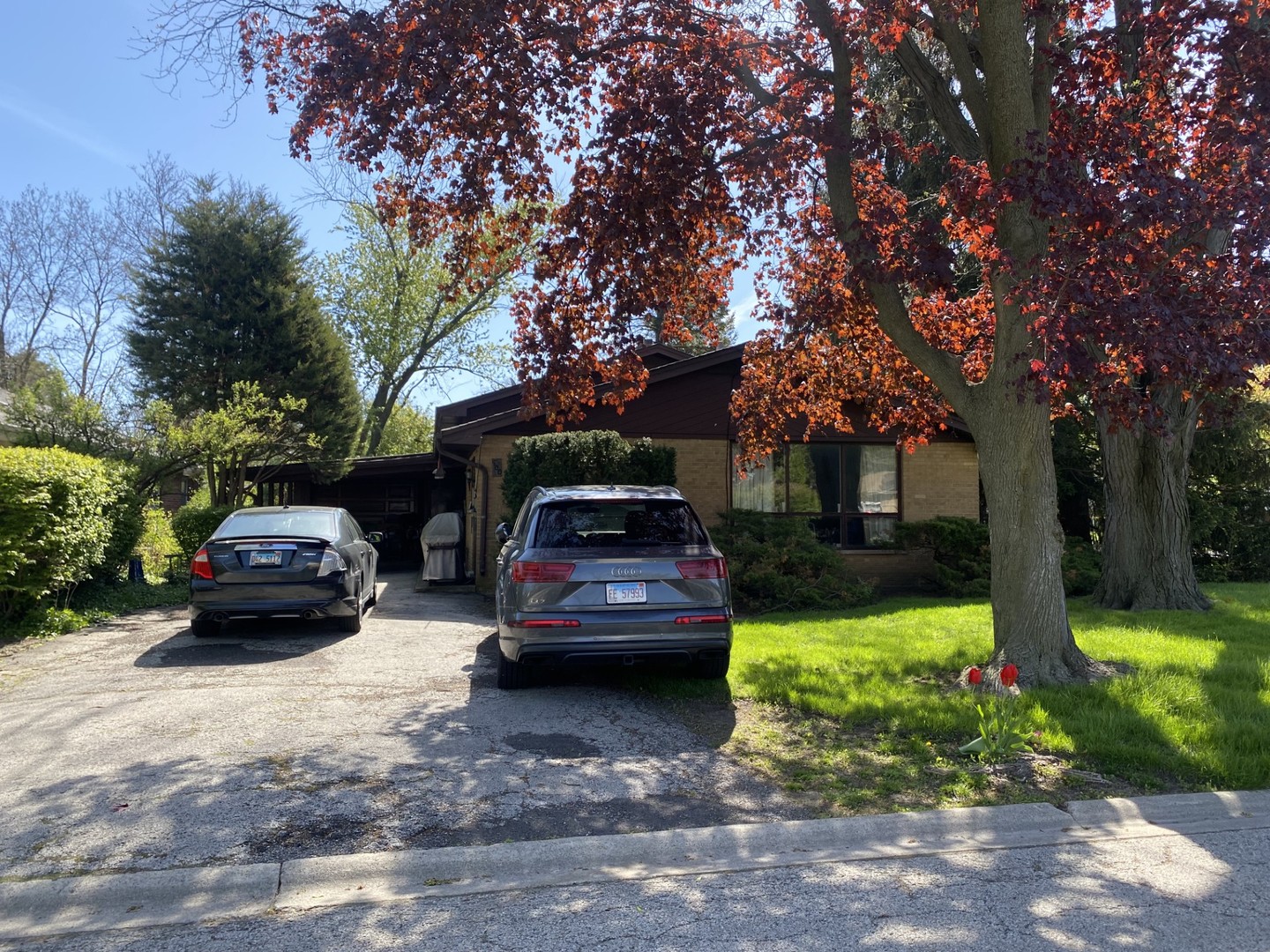 500 Kin Court Wilmette, IL 60091 - Photo 1 of 12 a view of a car parked in front of a house with cars parked on road