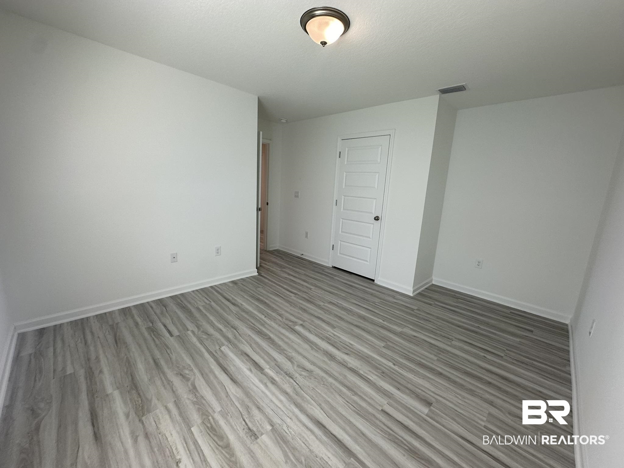 22227 Aleutian Avenue Foley, AL 36535 - Photo 10 of 64 Spare room featuring light hardwood / wood-style floors