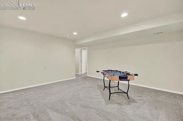 a room with a table and chairs