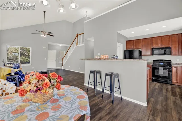 a bedroom with furniture and wooden floor