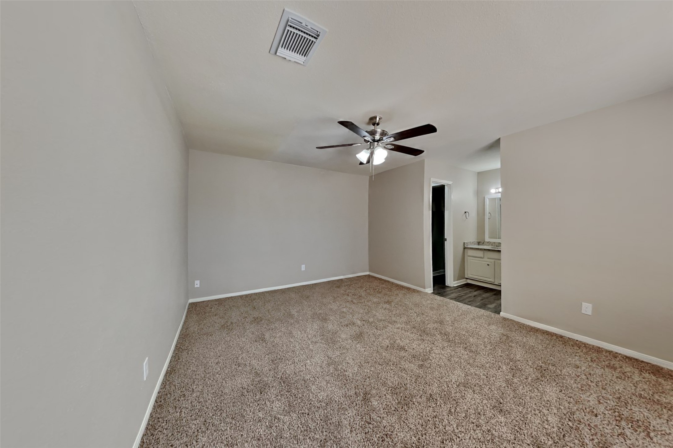 9615 Orangevale Drive Spring, TX 77379 - Photo 11 of 21 a view of an empty room with a chandelier fan