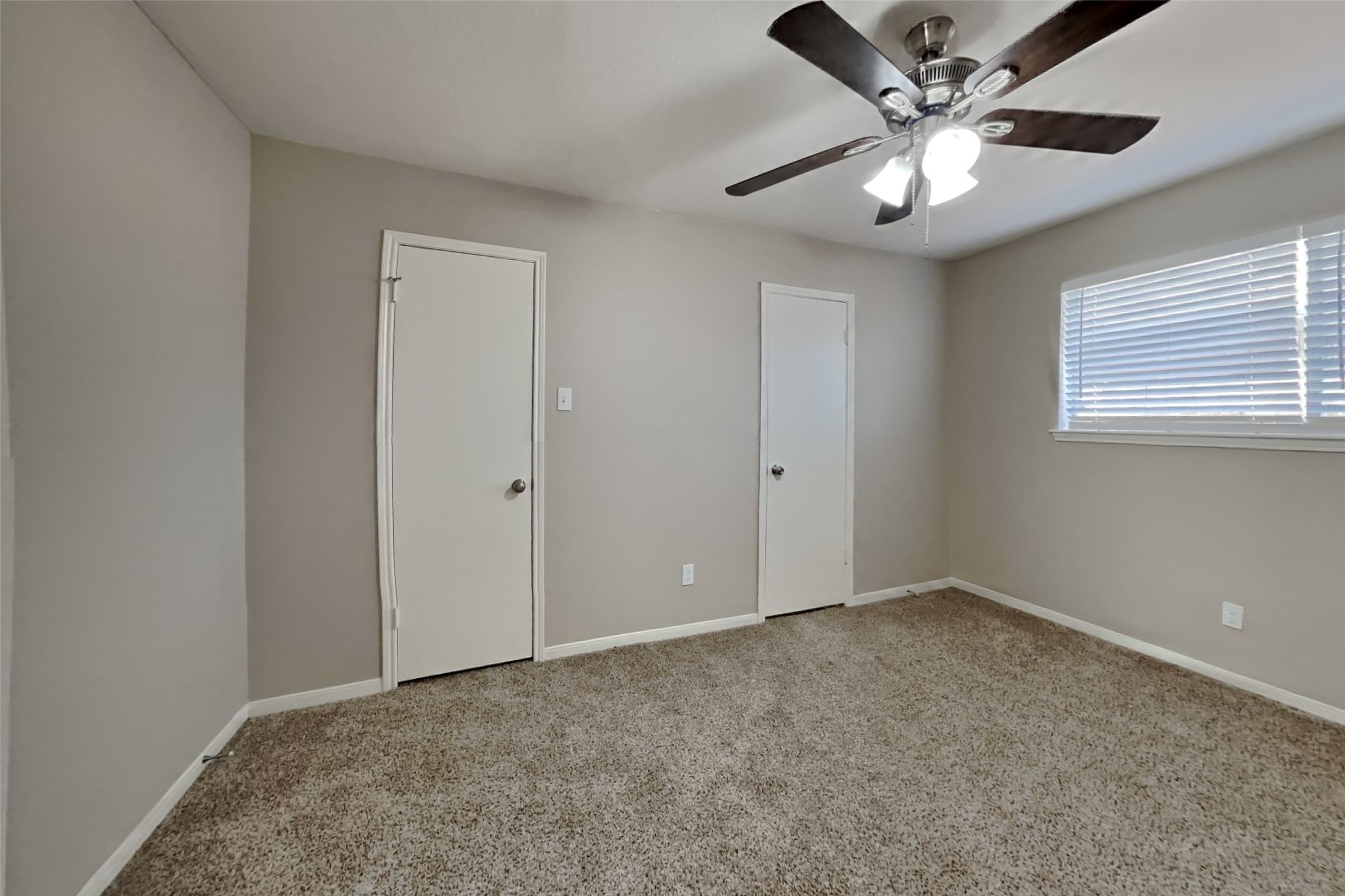 9615 Orangevale Drive Spring, TX 77379 - Photo 15 of 21 a view of an empty room with a chandelier fan