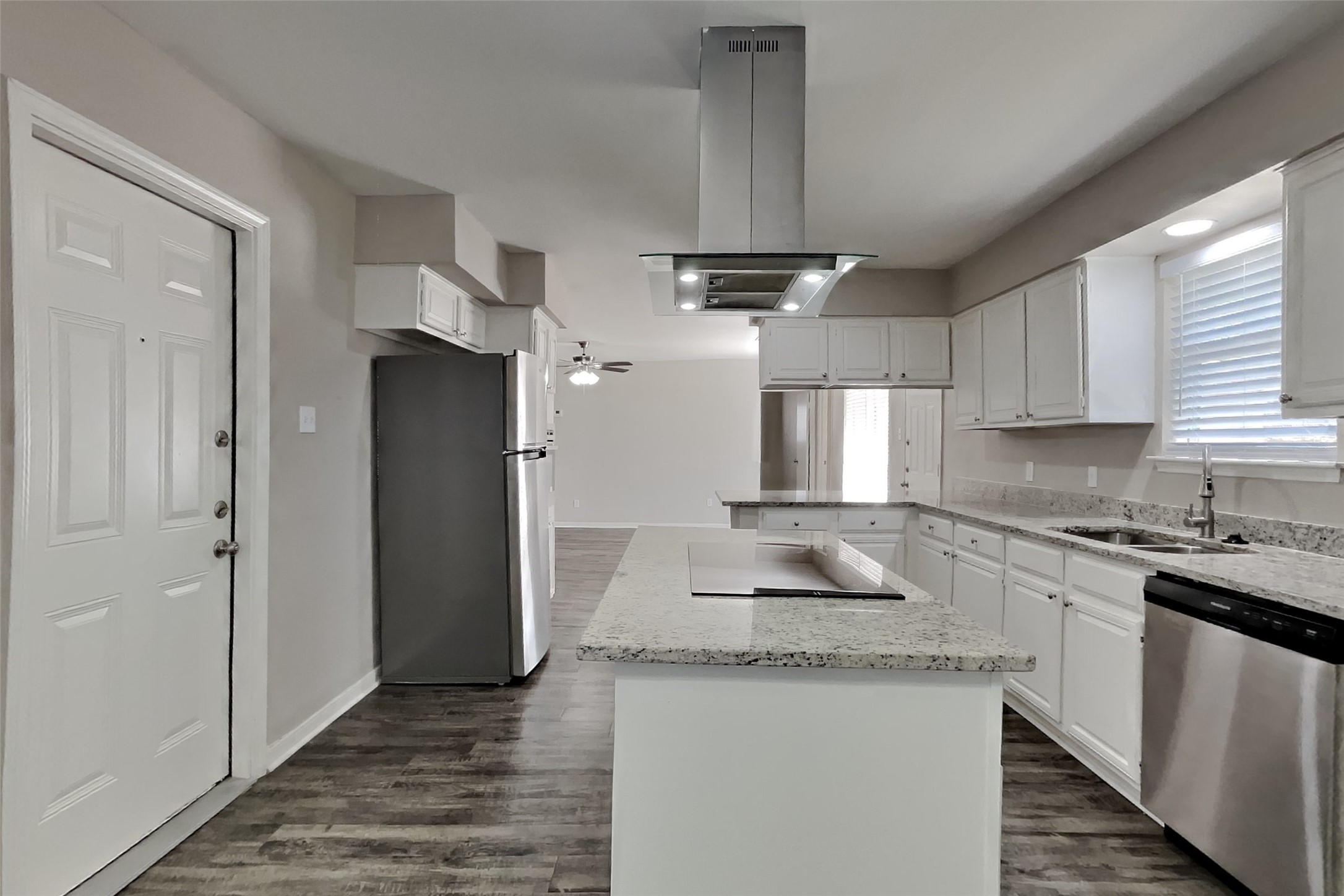 9615 Orangevale Drive Spring, TX 77379 - Photo 4 of 21 a kitchen with stainless steel appliances granite countertop a sink stove and refrigerator