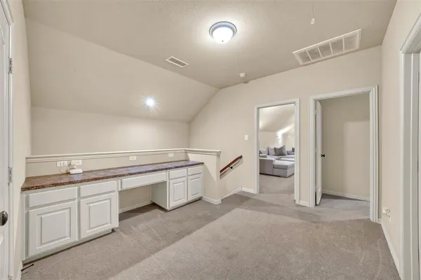a spacious bathroom with a sink and a mirror