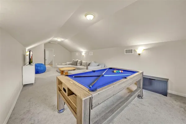 a living room with furniture and a night stand