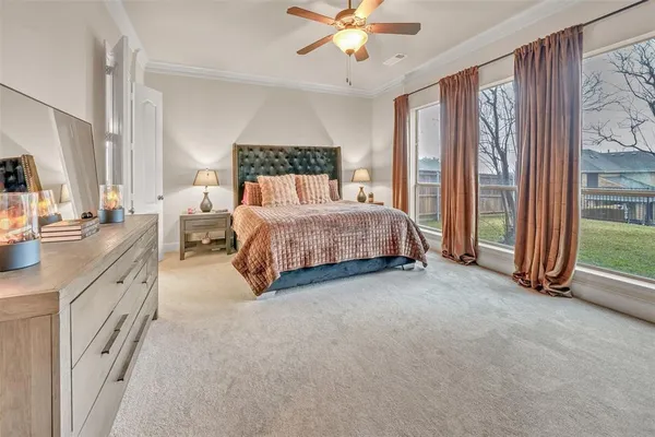 a living room with furniture kitchen view and a chandelier