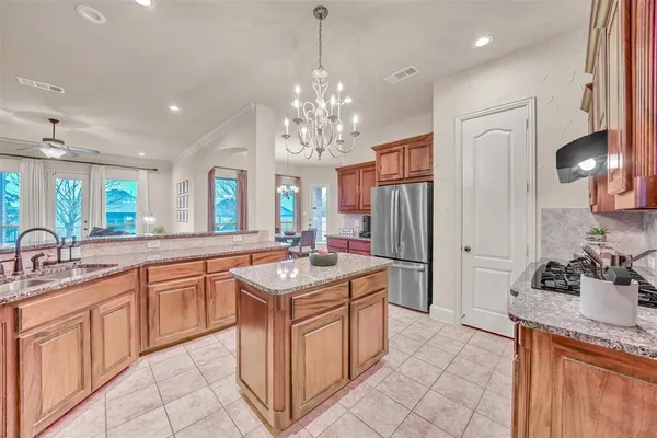 a living room with furniture a fireplace and wooden floor