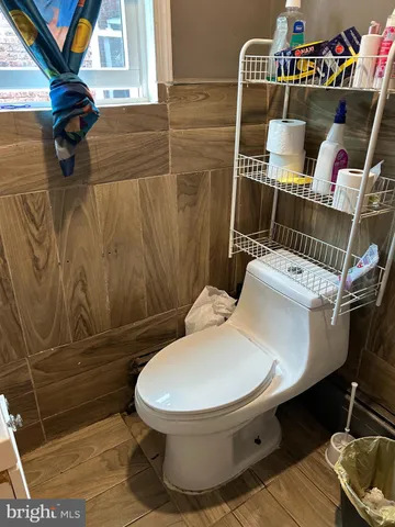 a bathroom with a toilet and a sink
