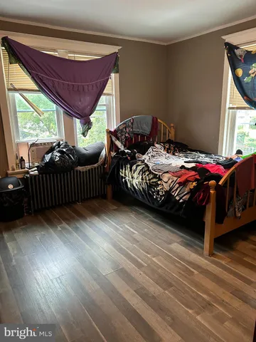 a bedroom with a bed window and a yard