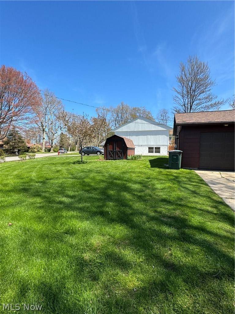 1763 Aberdeen Road Madison, OH 44057 - Photo 29 of 31 View of yard with a garage and an outdoor structure