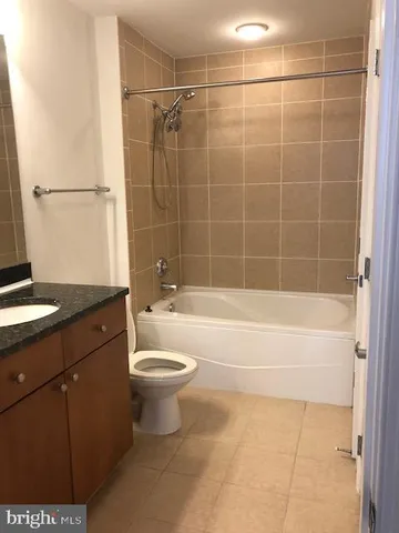 a bathroom with a shower and a sink