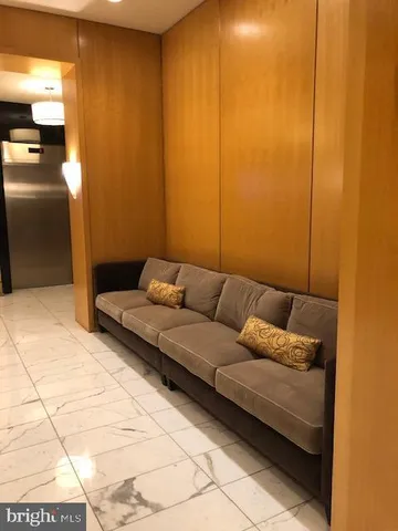 a view of a lobby with black carpet