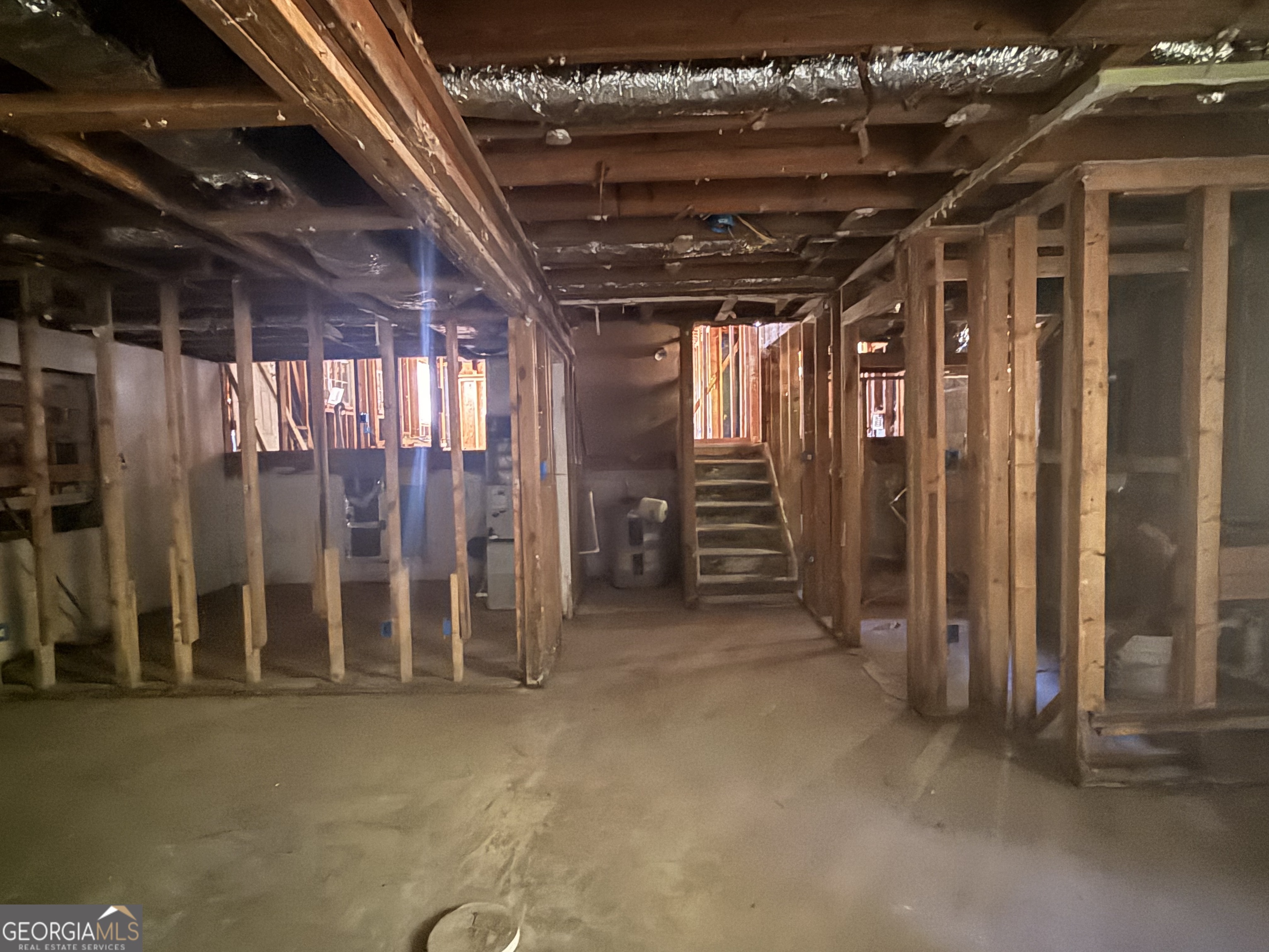 6750 Maddox Road Morrow, GA 30260 - Photo 5 of 11 a view of an empty room with wooden walls