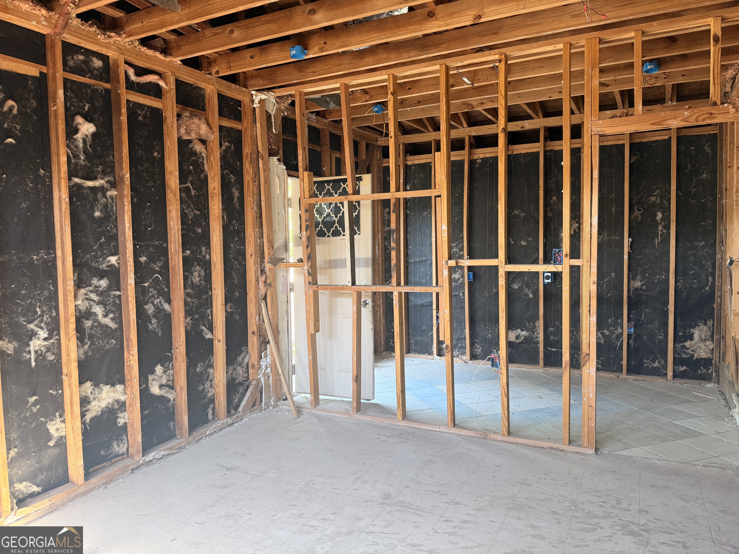 6750 Maddox Road Morrow, GA 30260 - Photo 9 of 11 a view of an empty room with wooden floor