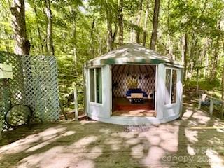 1710 Roaring Fork Road Mars Hill, NC 28754 - Photo 14 of 20 a view of a wooden door of the house