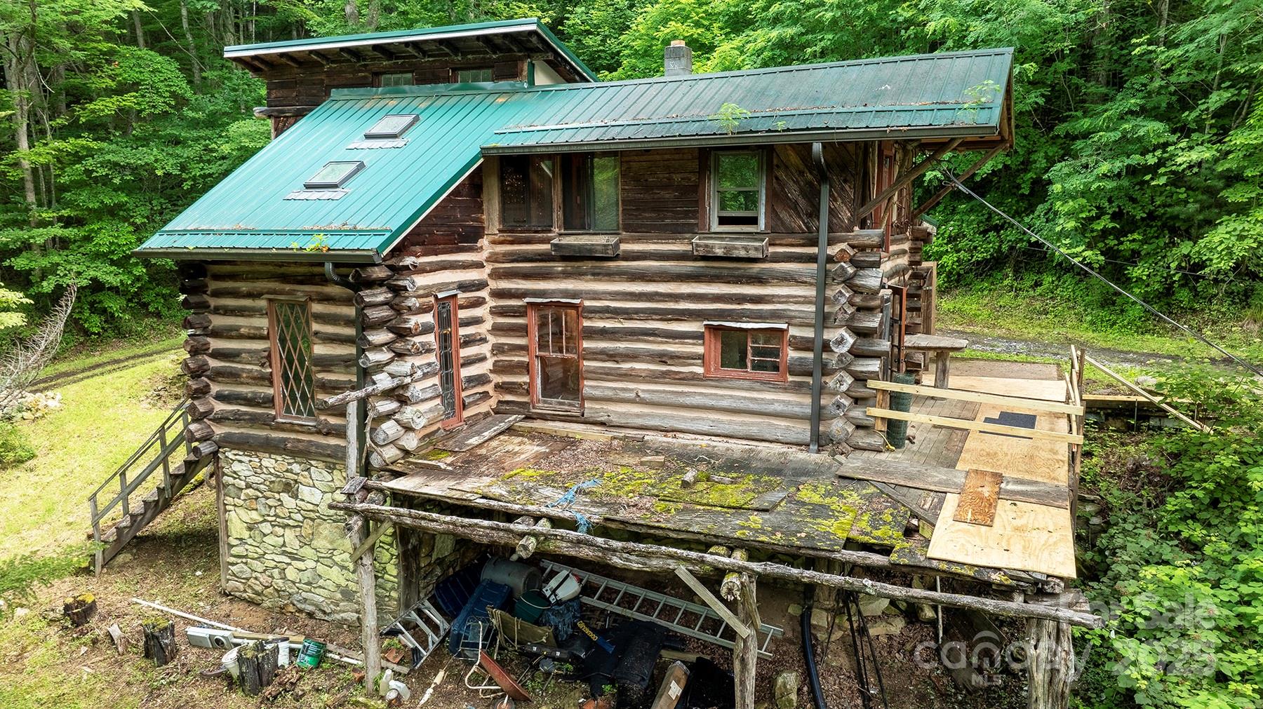 1710 Roaring Fork Road Mars Hill, NC 28754 - Photo 8 of 20 a view of a yard with table and chairs