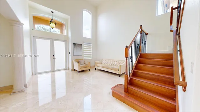 an empty room with closet and a ceiling fan