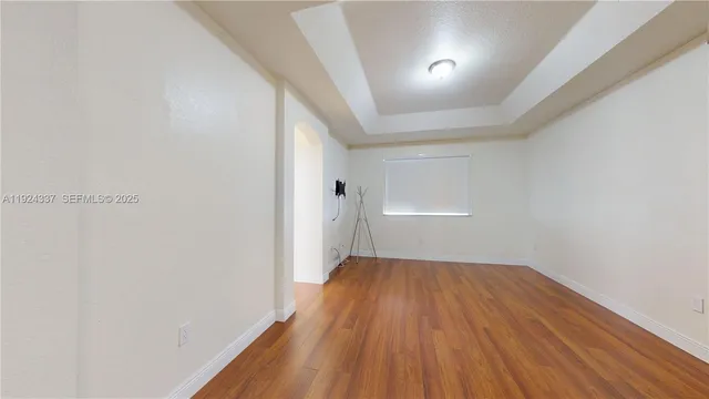 a bathroom with a sink a large mirror and a bathtub