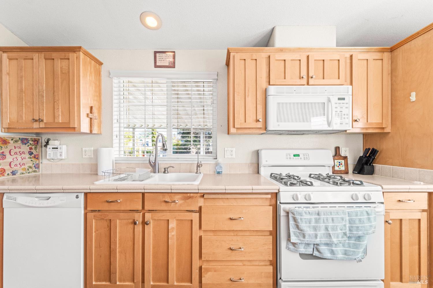 150 Silverado Trail, Unit 40 Napa, CA 94559 - Photo 11 of 40 a kitchen with stainless steel appliances granite countertop a sink stove and cabinets