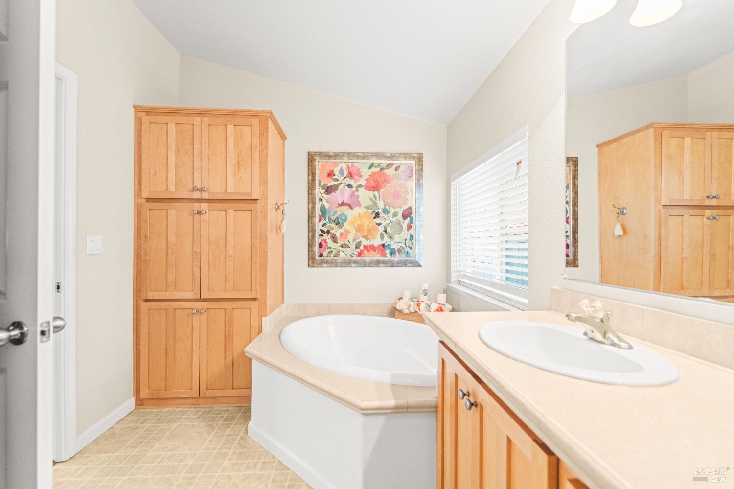 150 Silverado Trail, Unit 40 Napa, CA 94559 - Photo 25 of 40 a bathroom with a granite countertop sink and a mirror