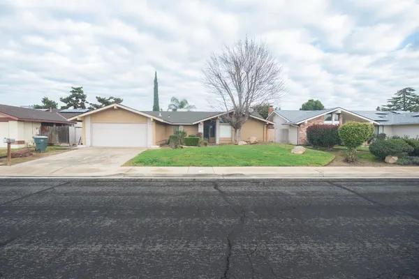 a view of a house with a street