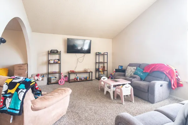 a living room with furniture and a large window