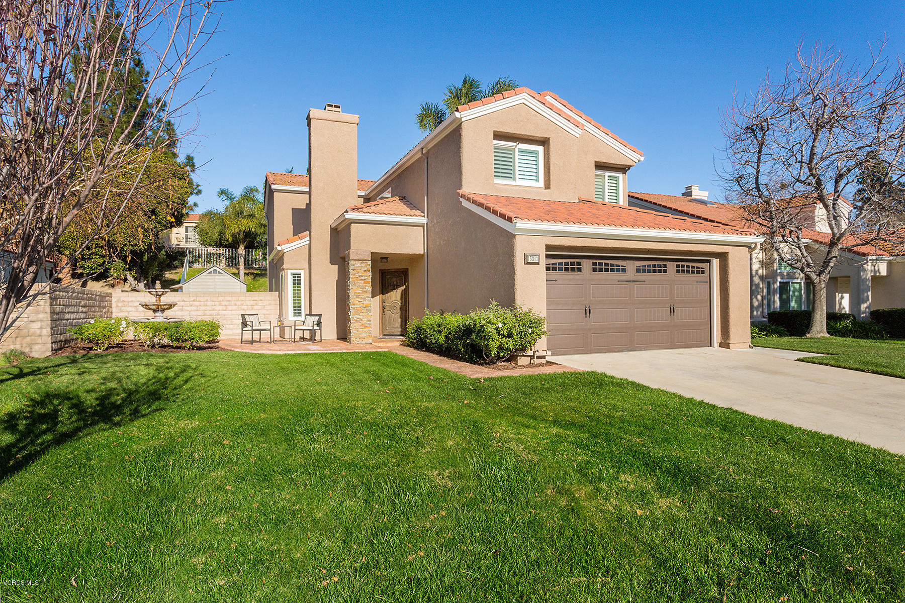 15317 Rains Court Moorpark, CA 93021 - Photo 1 of 34 a front view of a house with a yard and garage