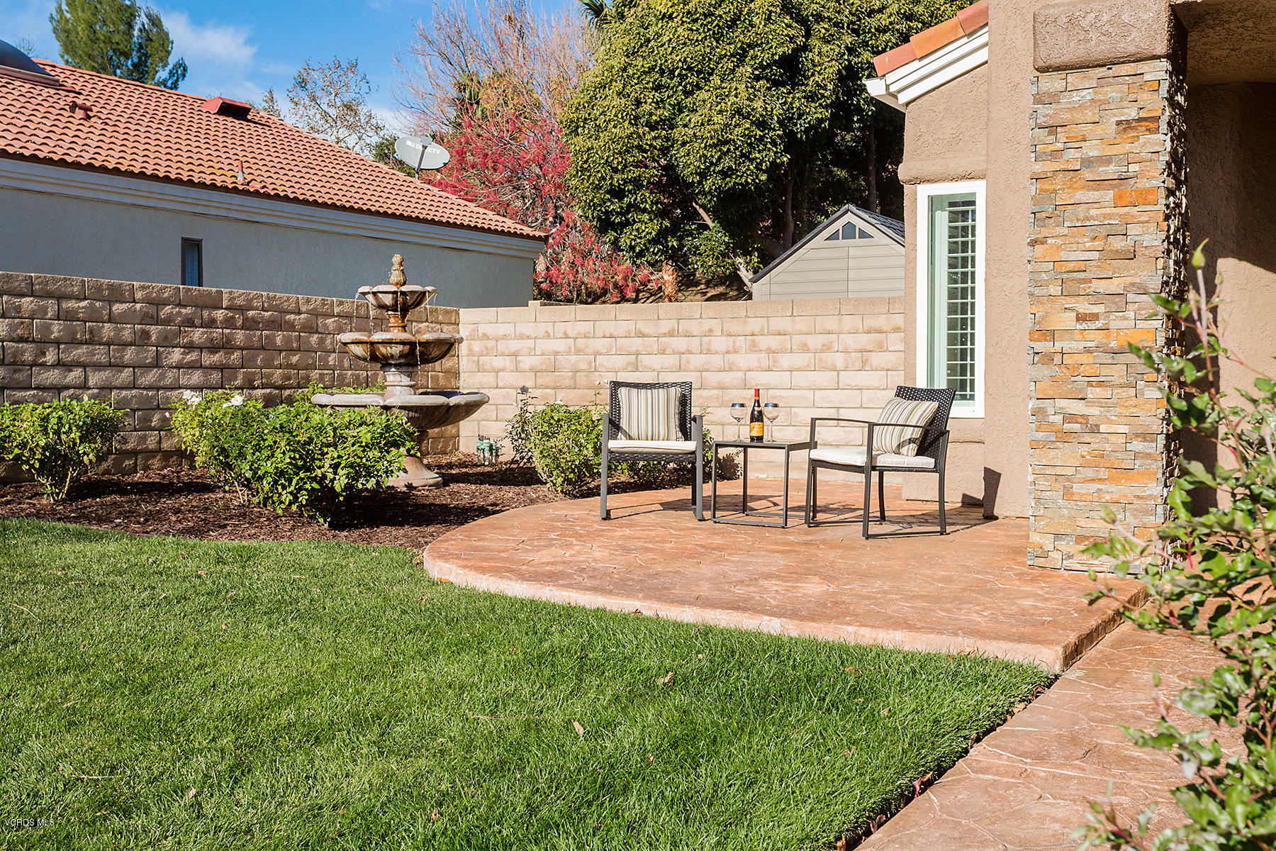 15317 Rains Court Moorpark, CA 93021 - Photo 2 of 34 a backyard of a house with table and chairs
